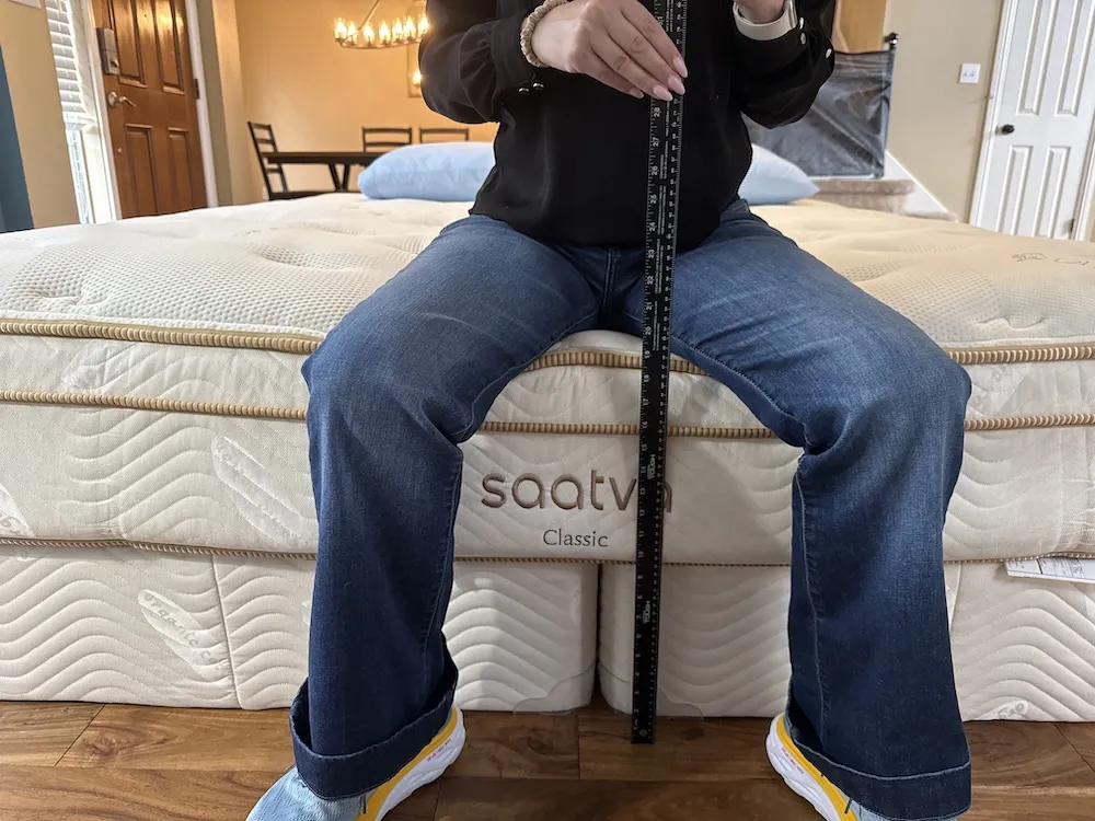 Measuring edge sinkage while sitting on the Saatva Classic mattress
