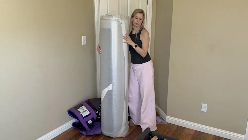 Positioning Purple Plus mattress on bed frame