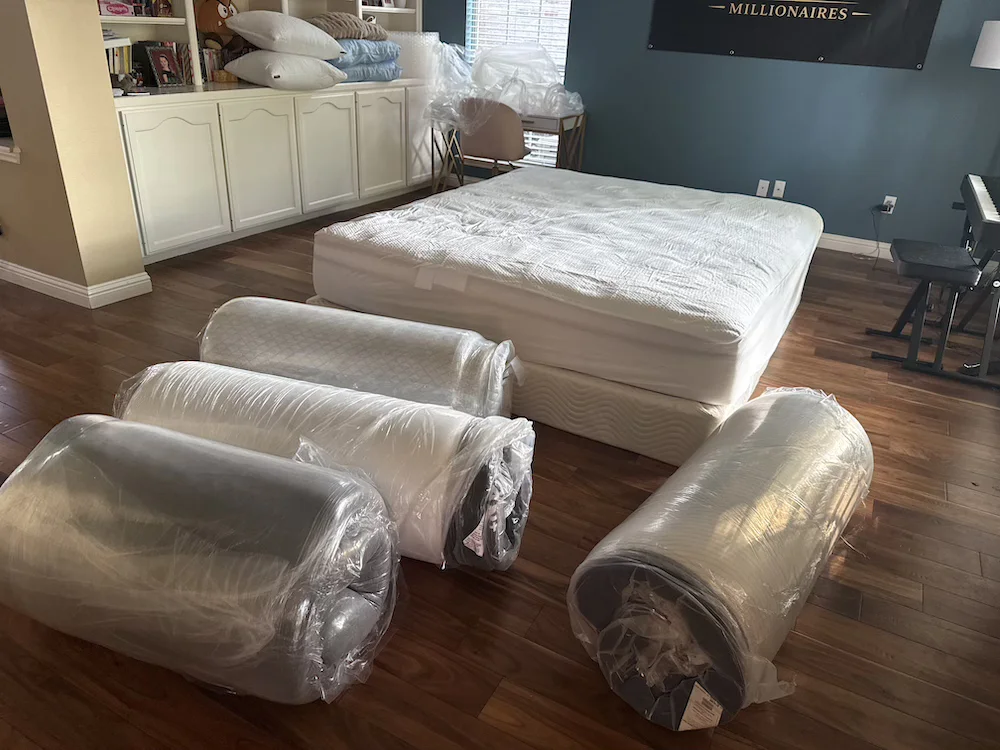 Multiple compressed mattresses prepared for side-sleeper testing