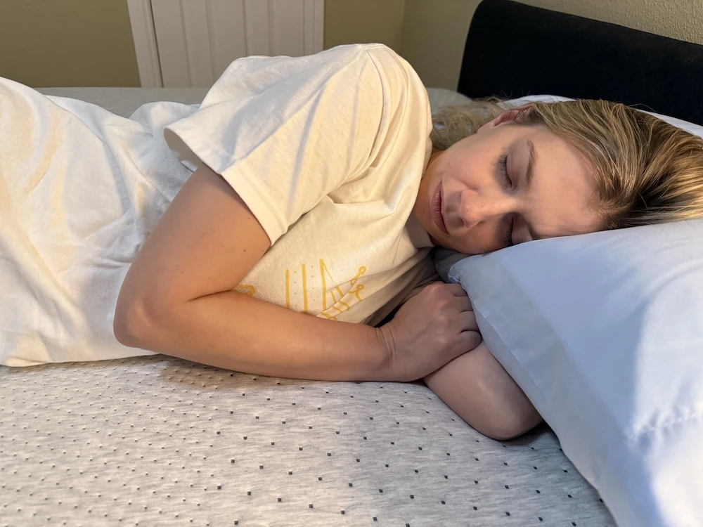 Close-up of side sleeper with pillow supporting the head and neck