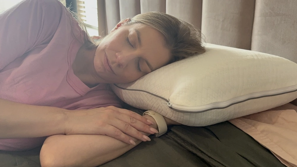 Adult side sleeper using a supportive pillow for comfort and sleep posture