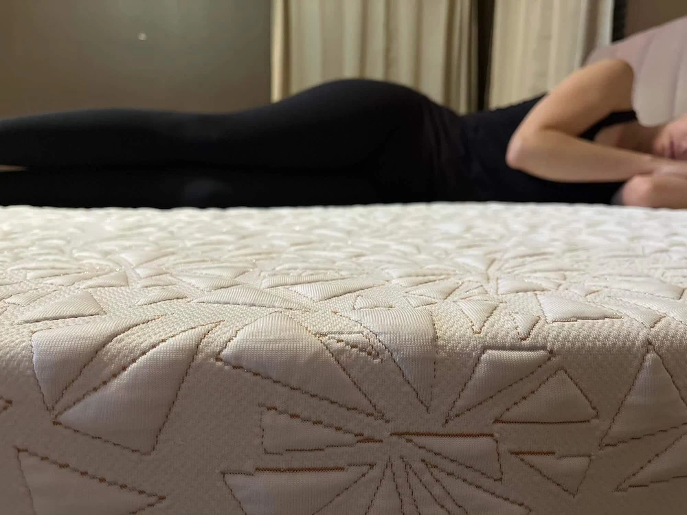 Image of a woman sleeping on her side