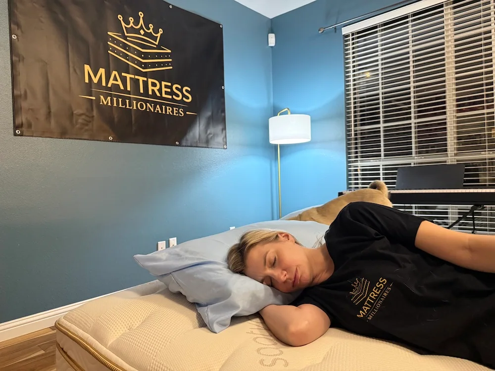 An image of a woman side sleeping on a bare mattress