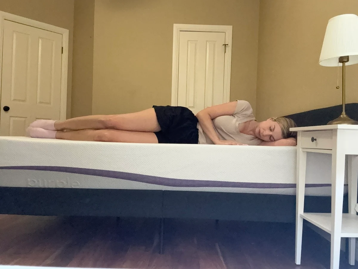 Image of a woman sleeping on a PurplePlus mattress