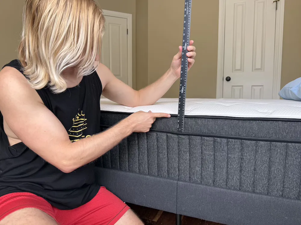 Measuring the height of the Titan Plus Luxe mattress with a ruler