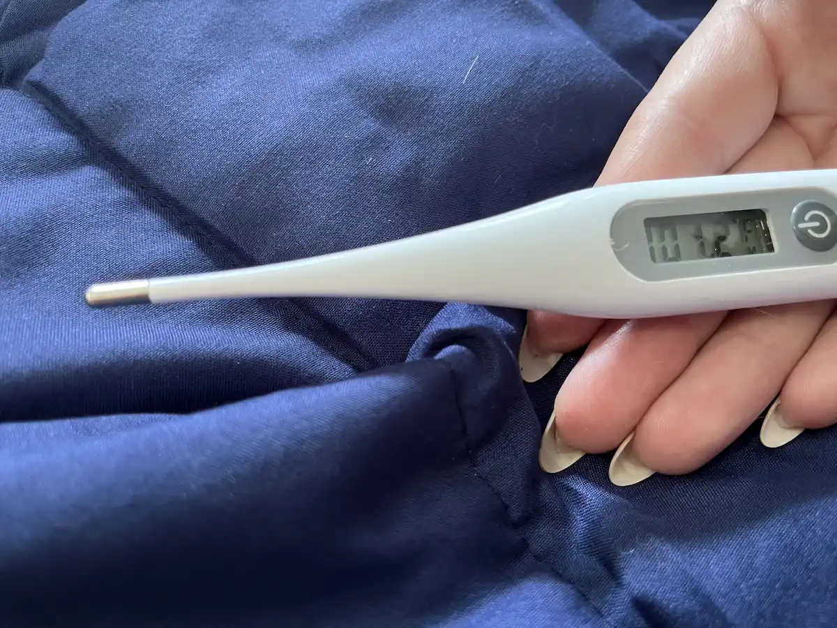 Thermometer showing elevated temperature while using a weighted blanket