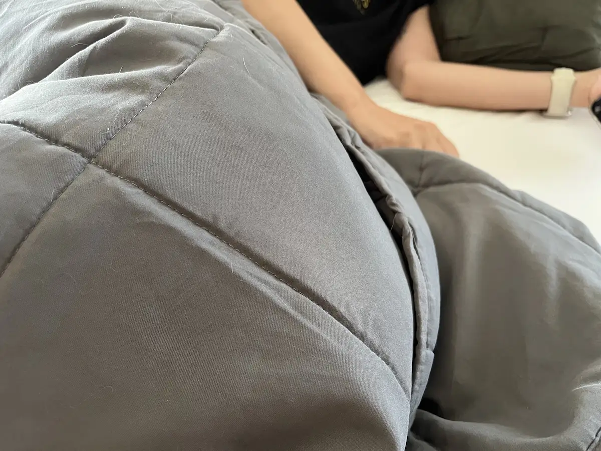 Close-up showing the evenly distributed weight and construction of a weighted blanket.