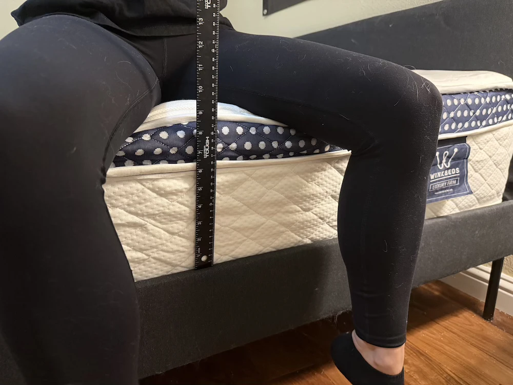 Sitting edge support test on the WinkBed Luxury Firm mattress with ruler measurement