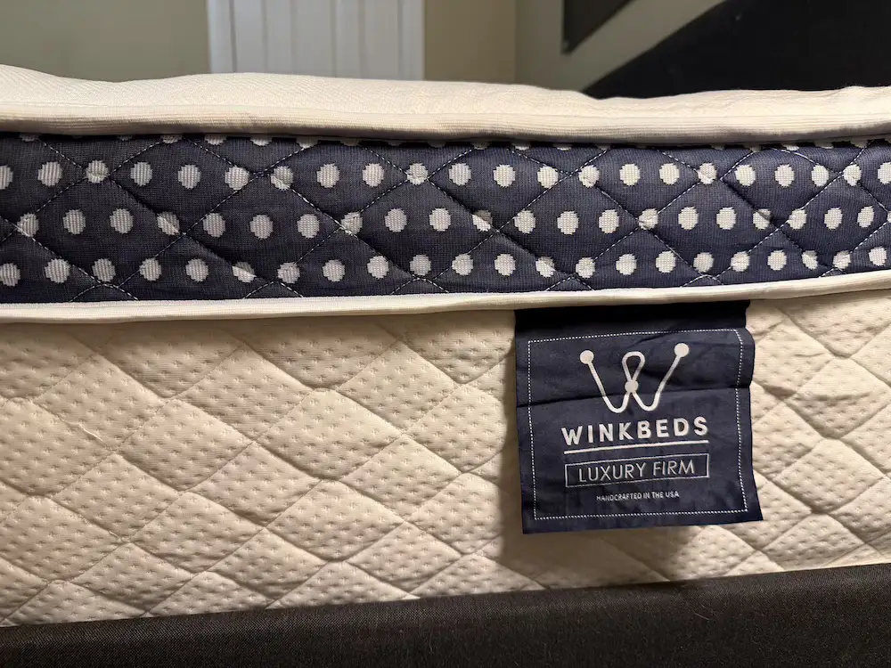 Close-up of the WinkBeds Luxury Firm mattress side panel and label