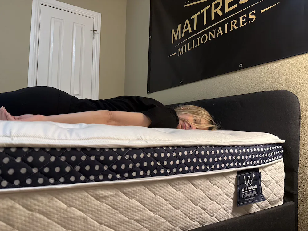 Stomach sleeper testing comfort on the WinkBed Luxury Firm mattress